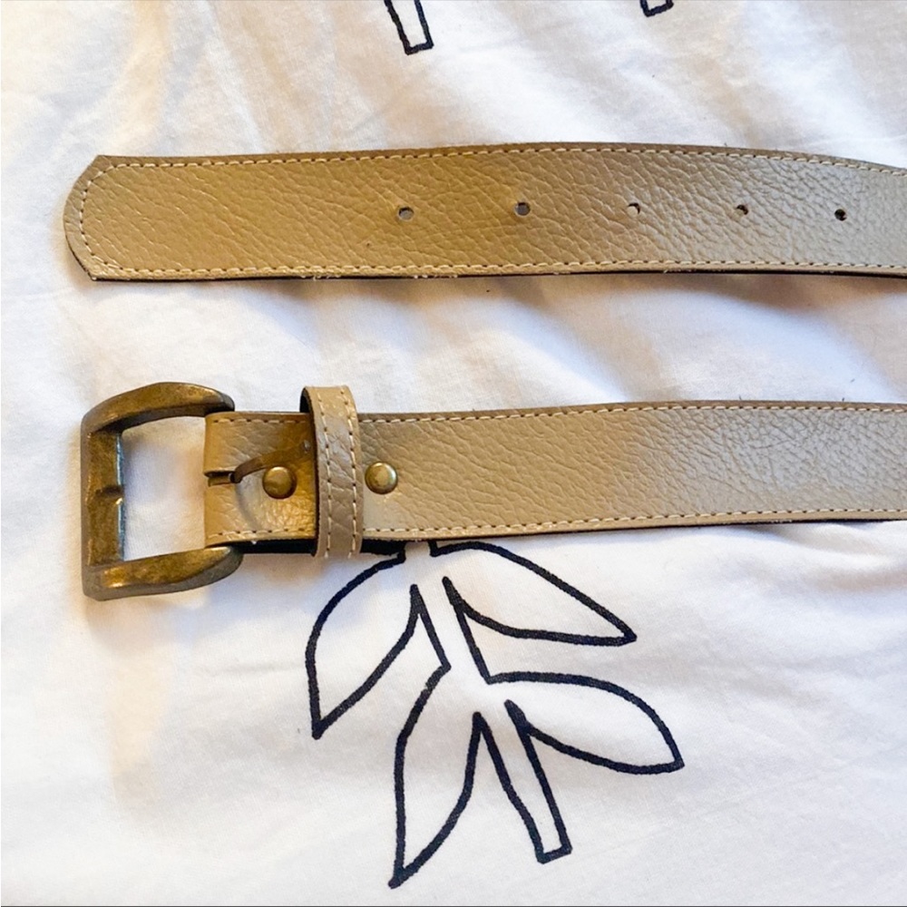 Tan leather belt with bronze buckle